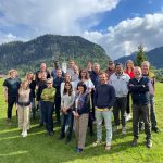 Group photo of all the participants at the QUANTA Spring 24 workshop. The green pre-alps of Charmey, Switzerland, in the background.